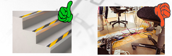 Das Bild zeigt farblich markierte Stufen sowie mangelhafte Verkabelung unter einem Schreibtisch.